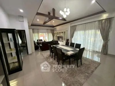Spacious modern living room with elegant dining area and stylish decor.