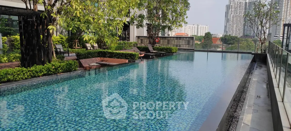 Luxurious rooftop pool with city skyline view and lush greenery, perfect for relaxation and leisure.