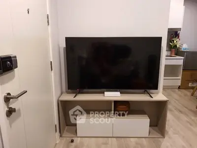 Modern living room with sleek TV stand and flat-screen television