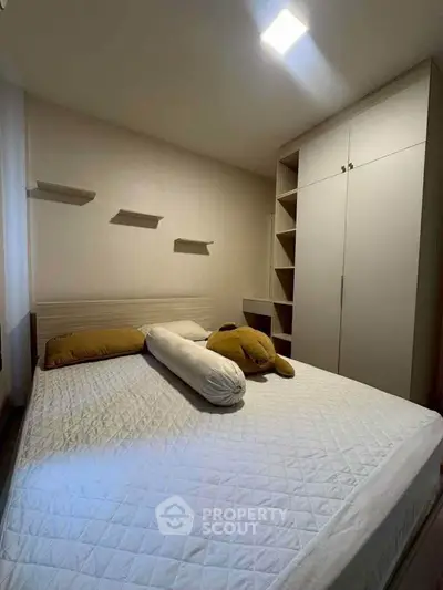 Cozy bedroom with modern design and ample storage space