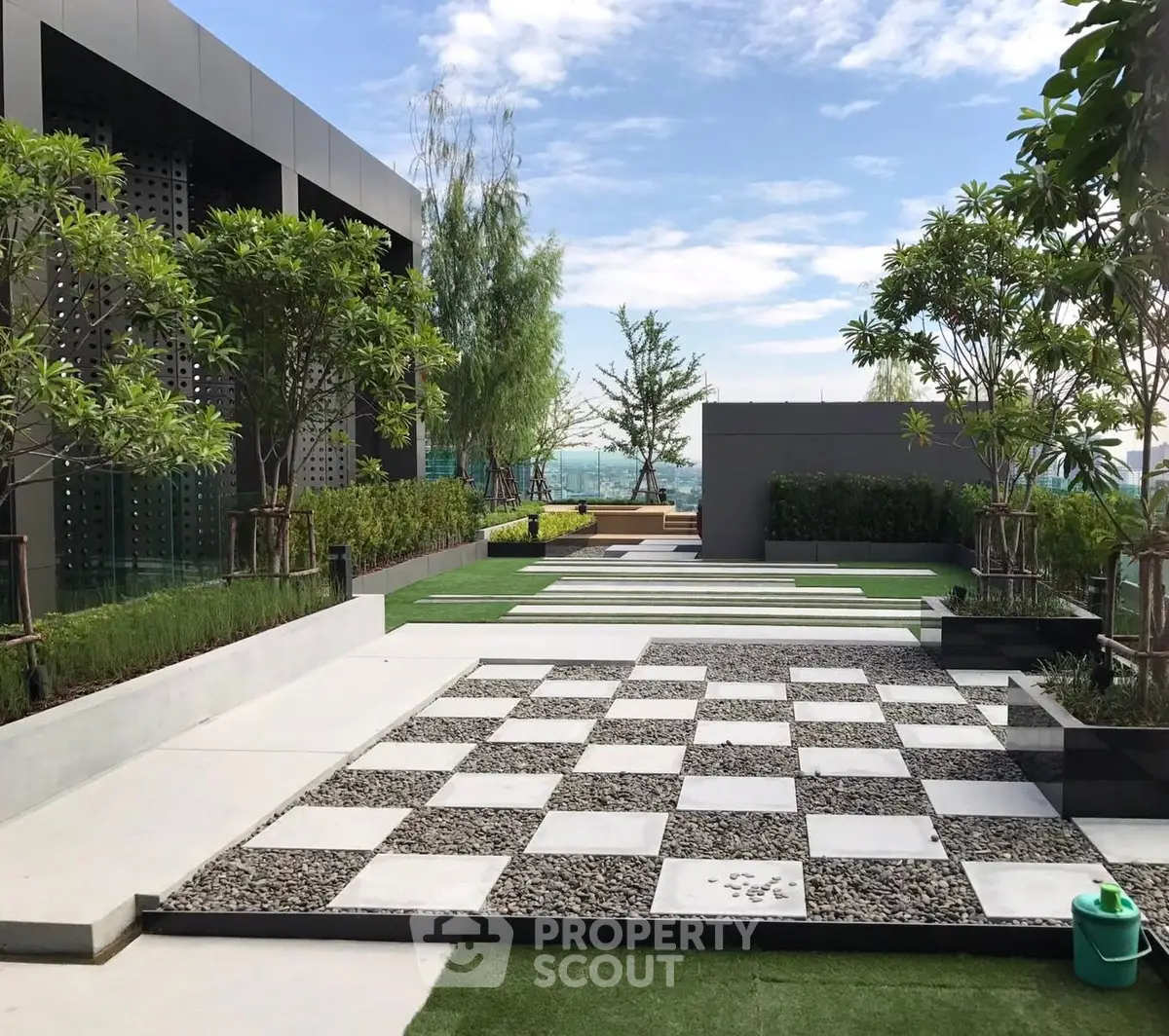 Luxurious rooftop garden with modern design and stunning city views, perfect for relaxation and entertainment.