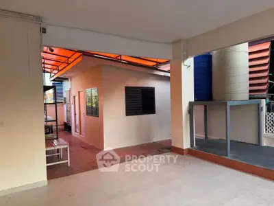 Spacious covered outdoor area with modern design and ample natural light.
