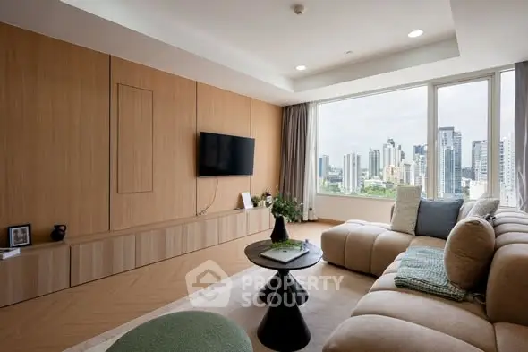 Modern living room with city view, stylish furniture, and large windows.
