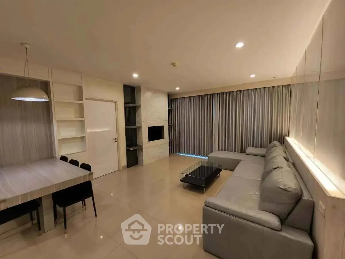 Spacious modern living room with sleek furniture and elegant lighting