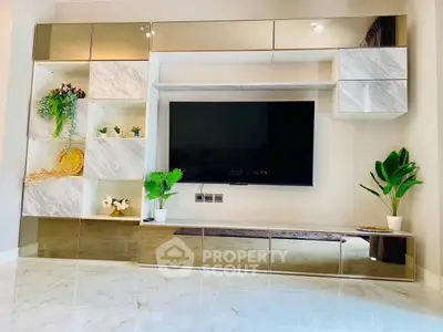Modern living room with sleek TV unit and elegant decor