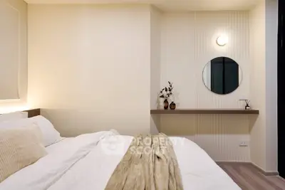 Modern bedroom with elegant decor and cozy bedding