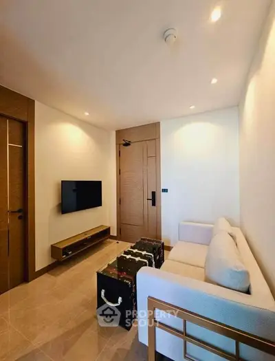 Modern living room with sleek TV setup and stylish furniture