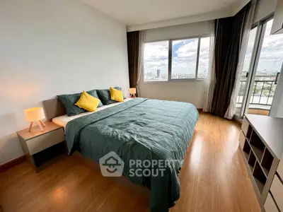 Spacious bedroom with city view and modern decor