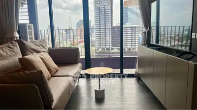 Modern living room with city view and cozy sofa in high-rise apartment