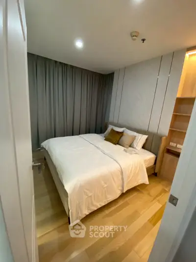 Cozy modern bedroom with elegant wooden flooring and soft lighting