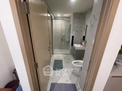 Modern bathroom with sleek design and glass shower enclosure