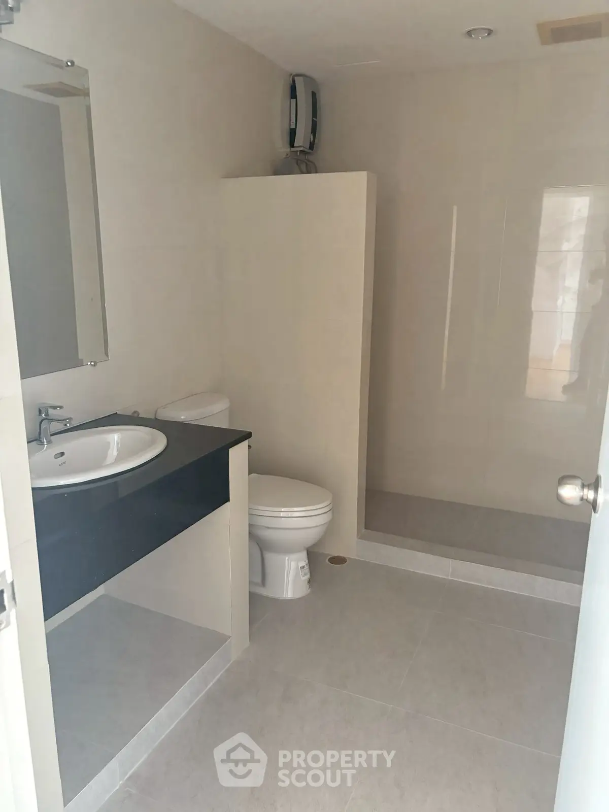 Modern bathroom with sleek fixtures and spacious shower area