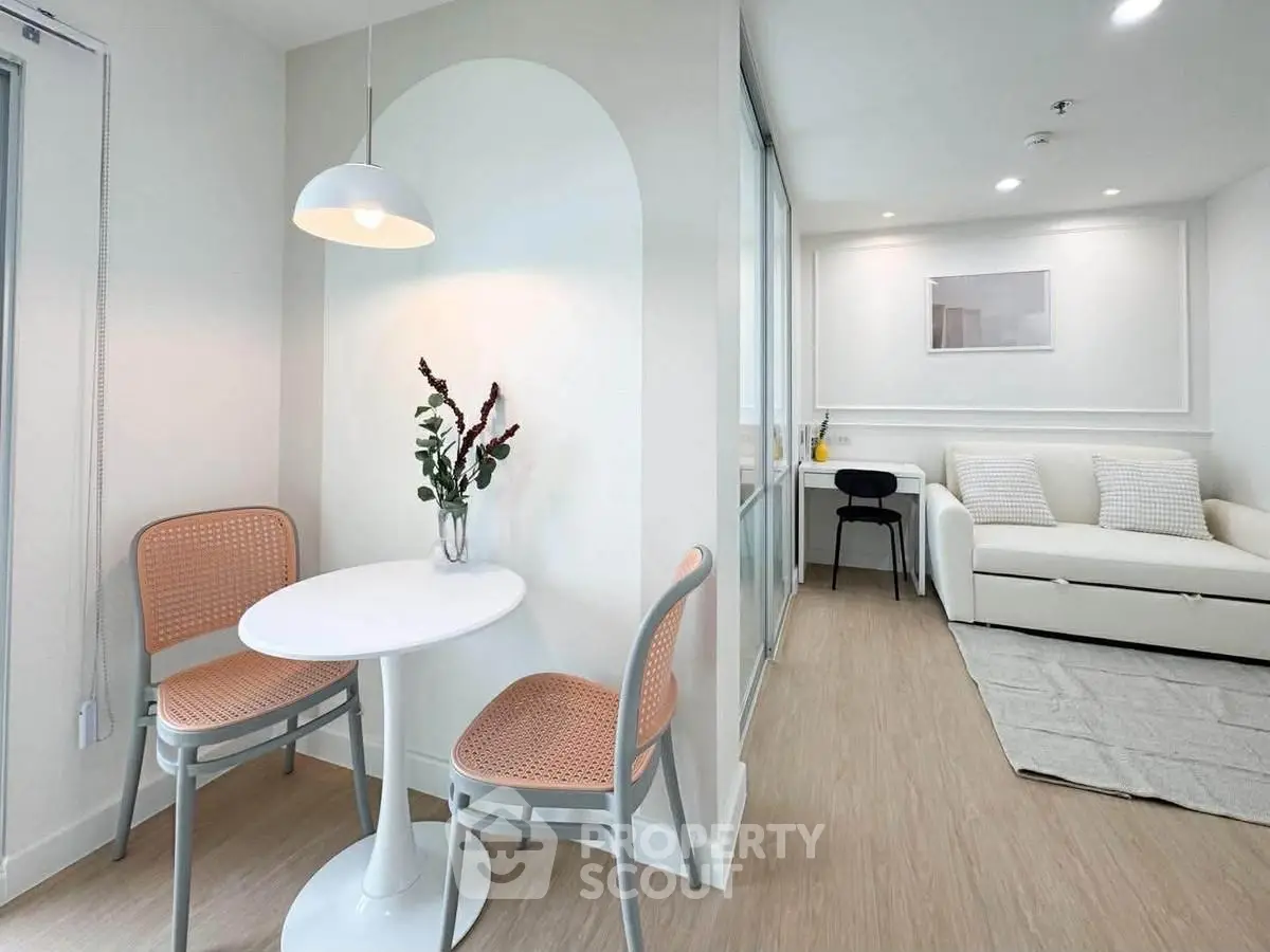 Modern minimalist living room with cozy seating and dining area