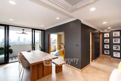Modern dining area with city view and stylish decor in a high-rise apartment