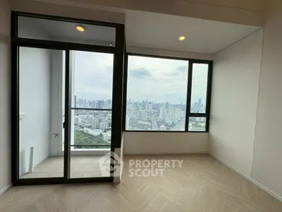 Spacious apartment with stunning city view and balcony access.