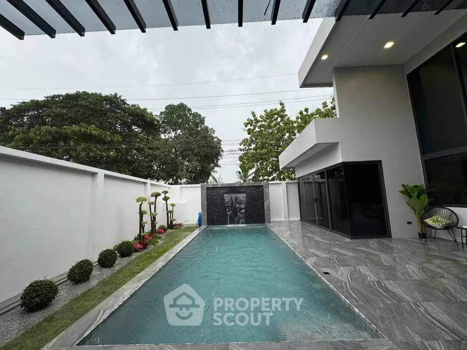 Modern luxury home with sleek pool and stylish outdoor design