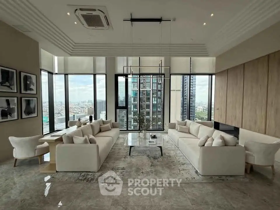 Luxurious modern living room with panoramic city views and elegant furnishings.