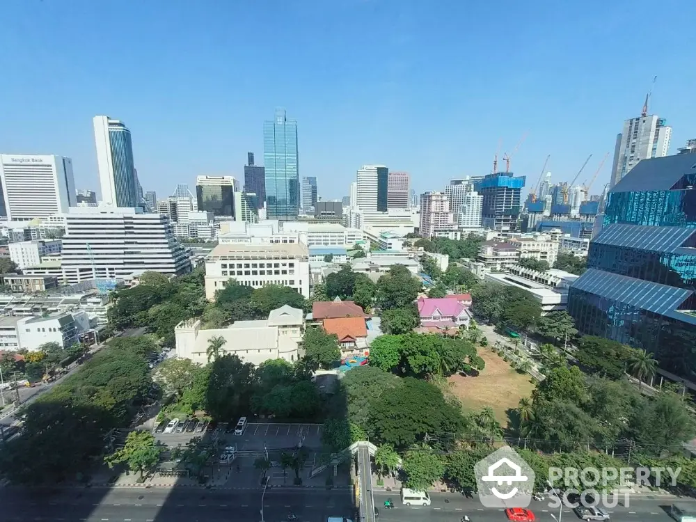 Stunning city skyline view with modern skyscrapers and lush greenery, perfect for urban living.