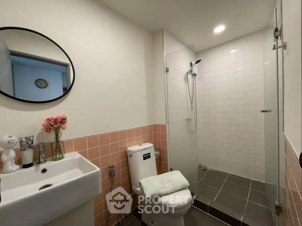 Modern bathroom with glass shower and stylish decor