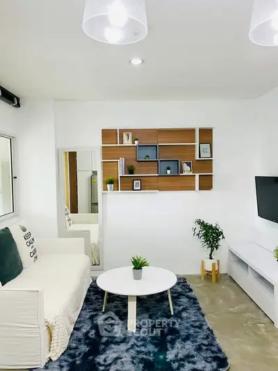 Modern living room with stylish shelving and cozy decor