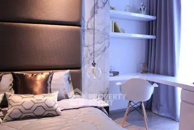 Modern bedroom with stylish decor and cozy workspace