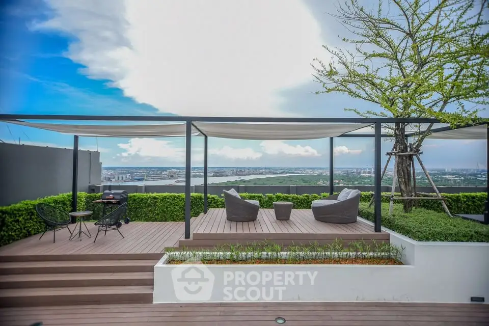Stunning rooftop terrace with panoramic city views and modern seating area.