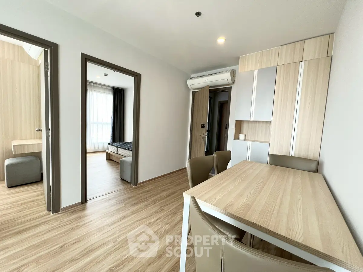 Modern apartment interior with wooden flooring and stylish furniture