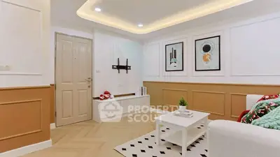 Stylish living room with modern decor and cozy ambiance, perfect for relaxation and entertaining.