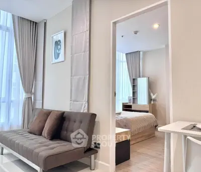 Modern apartment interior with stylish living room and cozy bedroom