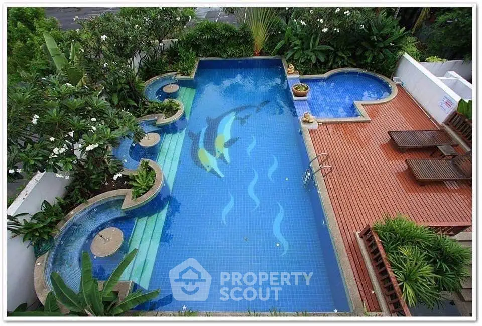 Luxurious rooftop pool with elegant design and lush greenery