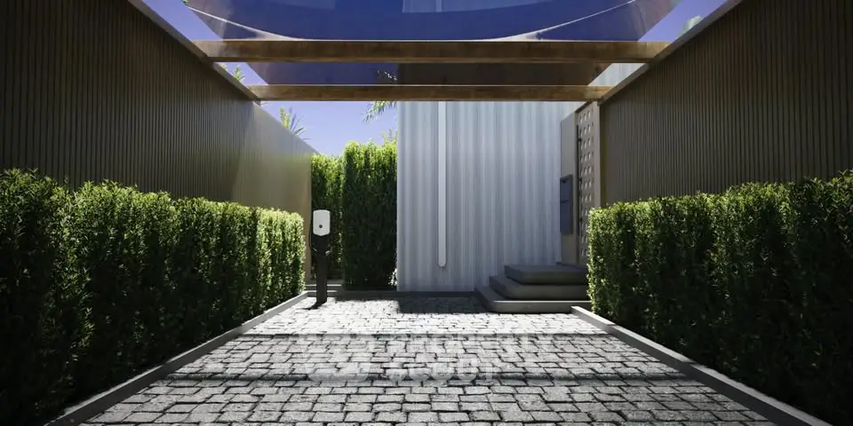Modern entrance with sleek design and lush greenery
