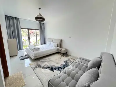 Spacious modern bedroom with elegant decor and natural light