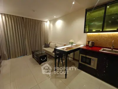 Cozy living room with modern kitchenette and elegant decor