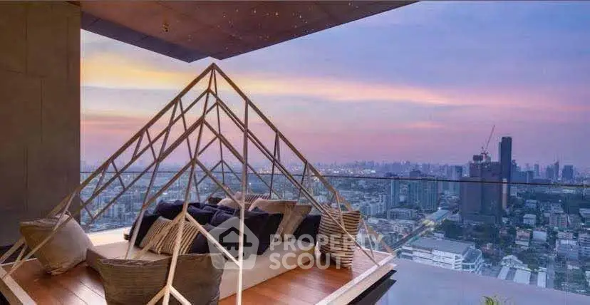 Luxurious rooftop terrace with stunning city skyline view at sunset, featuring cozy seating area.