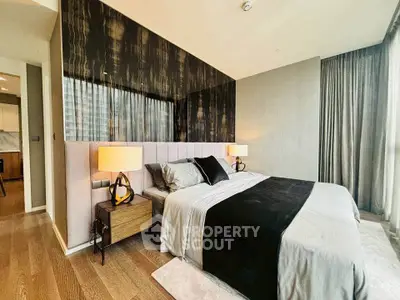 Luxurious modern bedroom with elegant decor and large windows for natural light.