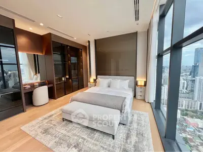 Luxurious high-rise bedroom with panoramic city views and elegant modern decor.