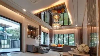 Luxurious living room with high ceiling and elegant chandelier