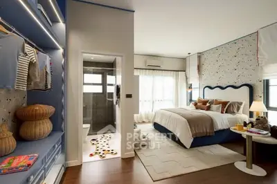 Luxurious bedroom with walk-in closet and stylish decor, featuring a cozy bed and elegant lighting.
