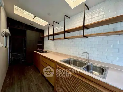 Modern kitchen with sleek wooden cabinets and open shelving