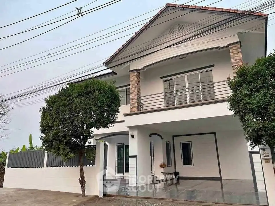 Elegant two-story house with modern facade and spacious driveway