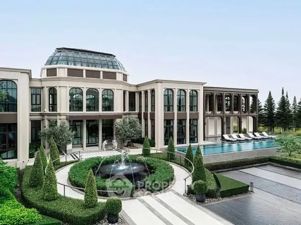 Luxurious mansion with pool and landscaped garden, featuring elegant architecture and serene surroundings.