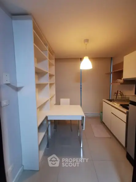 Modern kitchen with sleek cabinetry and dining area