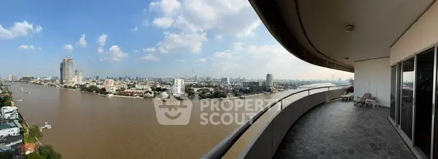 Stunning panoramic river view from spacious balcony in high-rise apartment