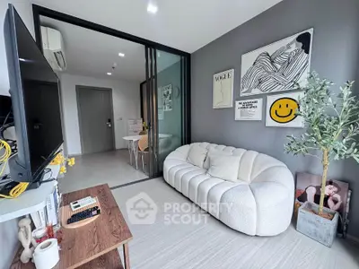 Modern living room with stylish decor and cozy seating in a contemporary apartment.
