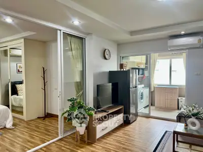 Modern open-plan living room with stylish decor and natural light