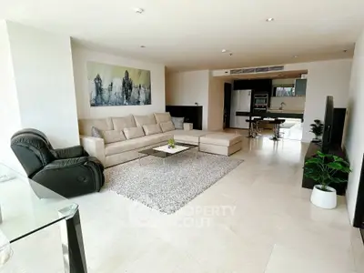 Spacious modern living room with elegant decor and open kitchen layout, perfect for luxury living.