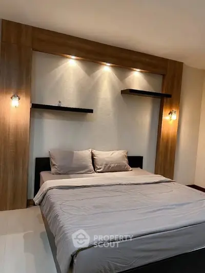 Modern bedroom with stylish wooden paneling and cozy lighting