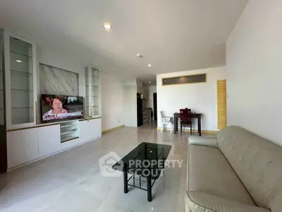 Spacious modern living room with sleek furniture and open layout, perfect for relaxation and entertainment.