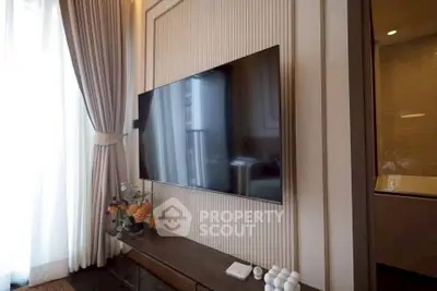 Modern living room with wall-mounted TV and elegant decor