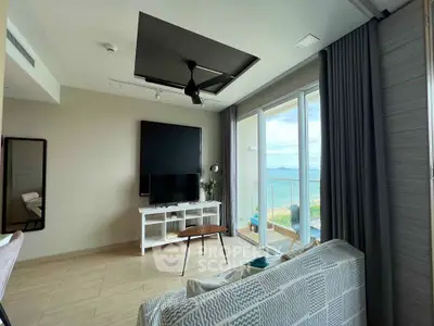 Modern living room with ocean view, stylish decor, and large windows for natural light.